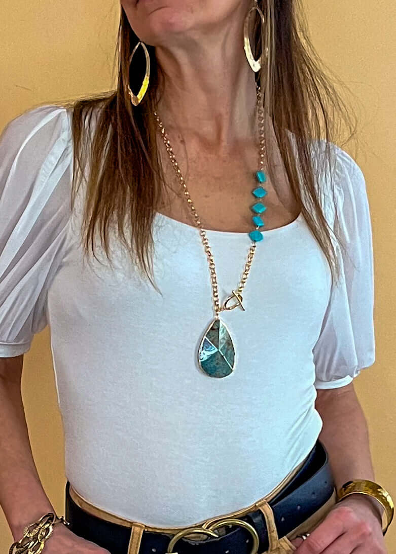 Exquisitely crafted necklace featuring a stunning turquoise pendant