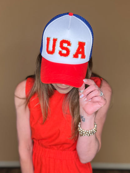 USA patch in red chenille with blue glitter on a foam style trucker cap