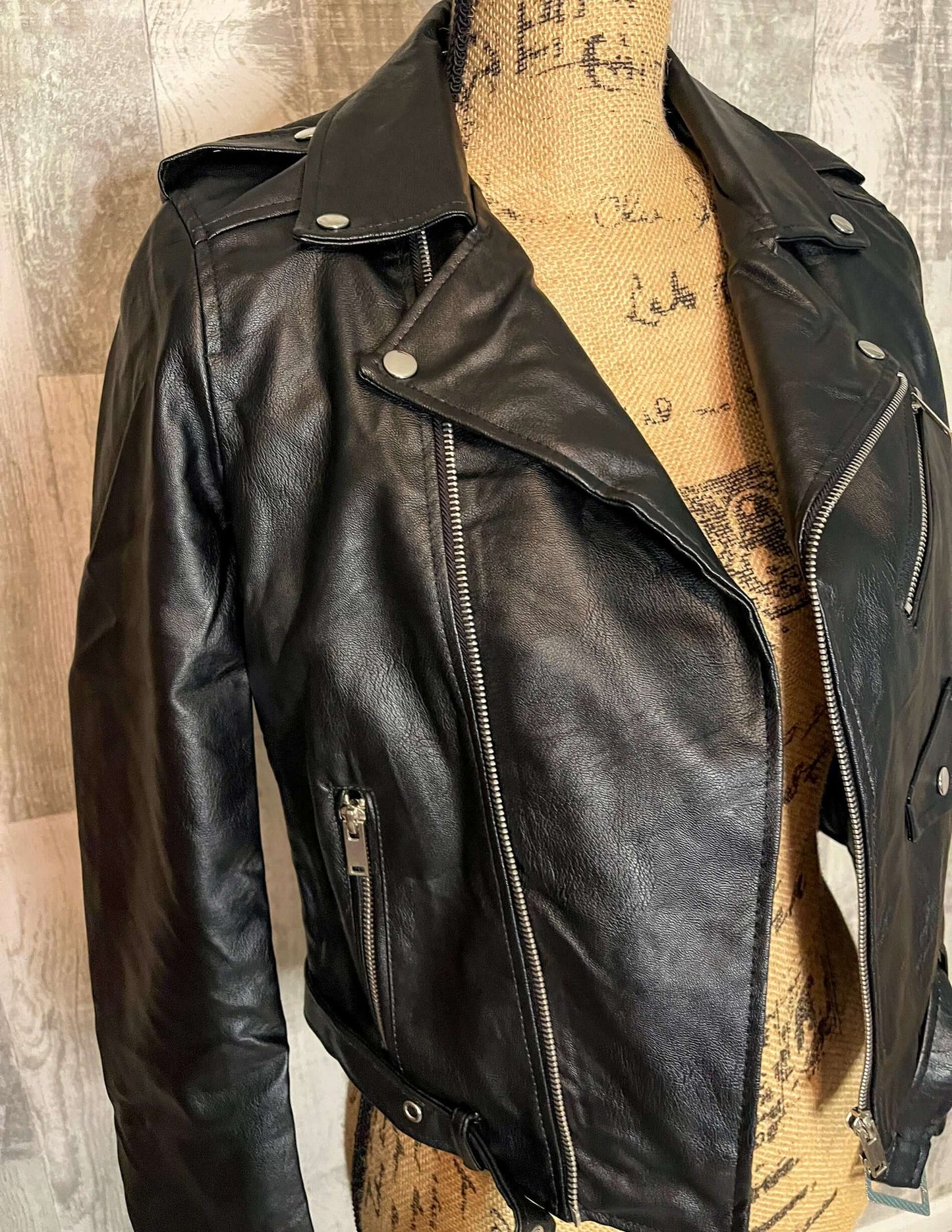 Side view showcasing the overall moto jacket styling.